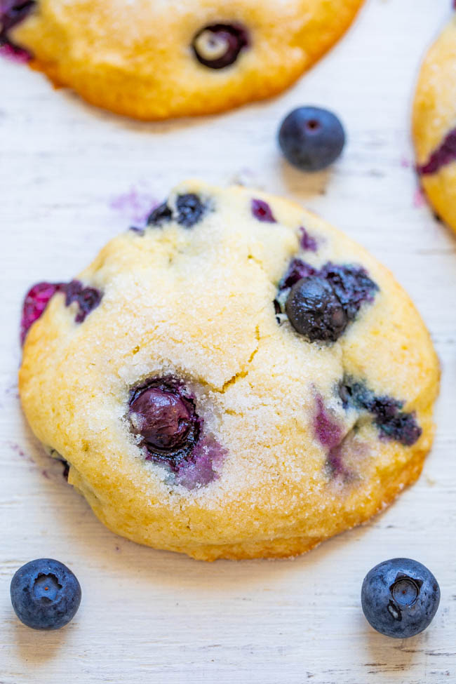 Blueberry Muffin Tops - If you like to eat just the tops of your muffins, you're going to LOVE this EASY recipe for soft and tender blueberry muffin tops bursting with juicy berries in every bite!! Only 1/2 cup sugar in the entire batch!!
