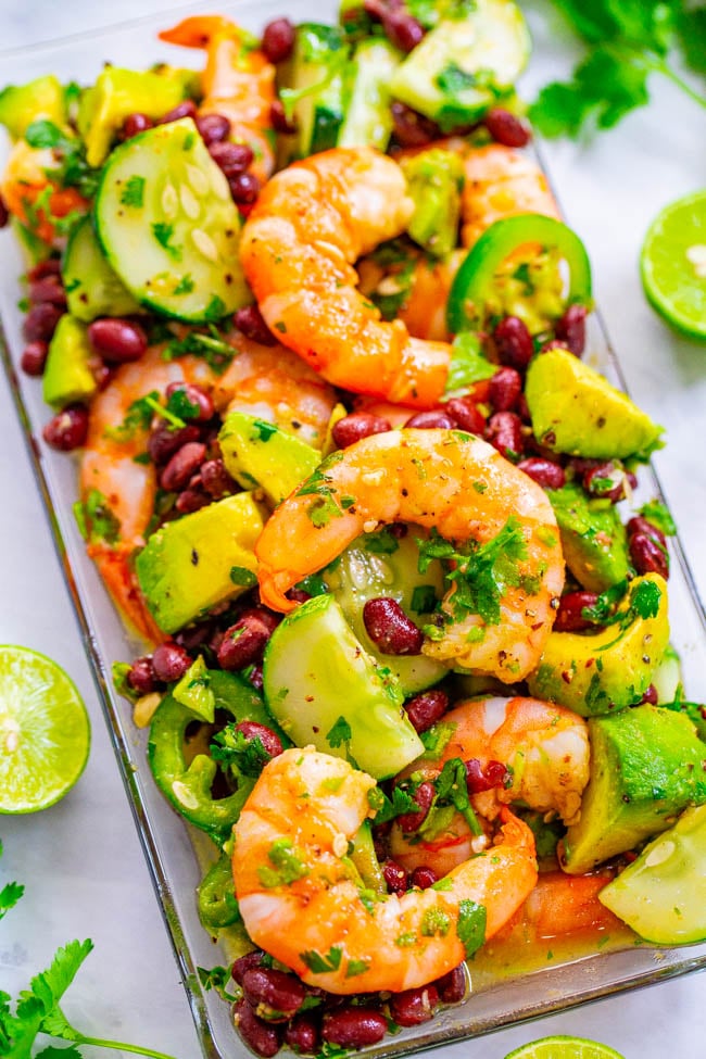Lime Cilantro Shrimp and Black Bean Salad - Tender juicy shrimp, black beans, avocado, cilantro, and more coated in a lime sauce that's a FIESTA in your mouth!! An EASY and HEALTHY Mexican-inspired salad that’s ready in 10 minutes!!