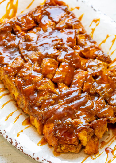 Overnight Caramel French Toast Casserole - EASY, soft, tender, and decadent French toast that's coated in caramel sauce!! Assemble it the night before and wake up to an amazing breakfast or brunch that everyone will ADORE!!
