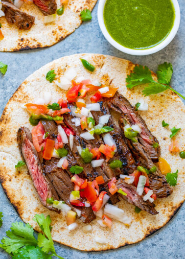 Carne Asada Tacos - EASY carne asada at home that rivals your favorite restaurant!! Tender juicy beef that's seasoned to perfection and topped with pico de gallo and salsa make these carne asada tacos INCREDIBLE!!
