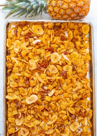 Piña Colada Chex Mix - An EASY and addictively AMAZING salty-sweet snack!! It's crunchy, chewy, and between the pineapple, coconut, banana, and lime you'll feel like you're on a tropical vacation!!