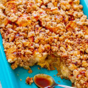 A blue baking dish with caramel apple French toast casserole, servings missing.