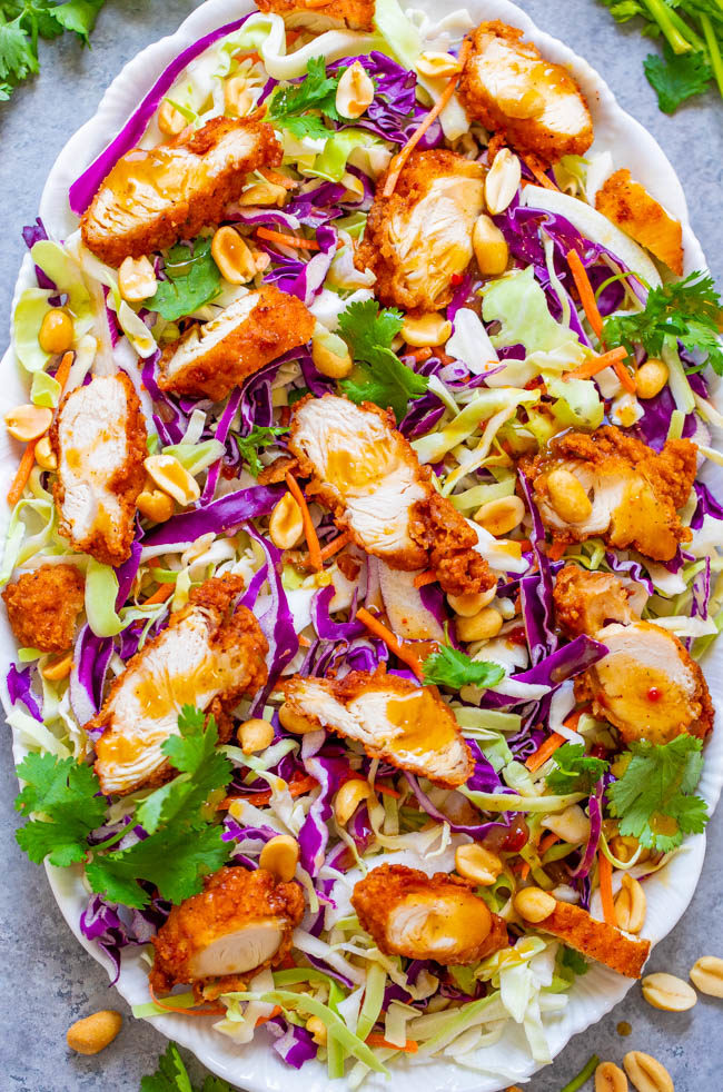 Crunchy Peanut Chicken Salad - Crispy fried chicken with crunchy cabbage, carrots, peanuts, cilantro and the EASIEST and BEST homemade peanut sauce that coats every bite!! A salad that you'll CRAVE over and over!! 