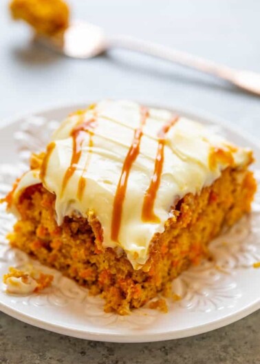 Salted Caramel Carrot Cake with Cream Cheese Frosting - Soft, tender carrot cake infused with salted caramel sauce and topped with tangy cream cheese frosting is the ULTIMATE in decadence!! Calling all carrot cake fans, you will LOVE this version!!