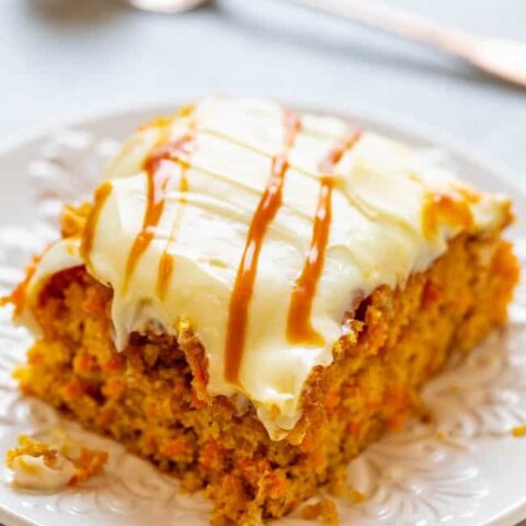 Salted Caramel Carrot Cake with Cream Cheese Frosting - Soft, tender carrot cake infused with salted caramel sauce and topped with tangy cream cheese frosting is the ULTIMATE in decadence!! Calling all carrot cake fans, you will LOVE this version!!