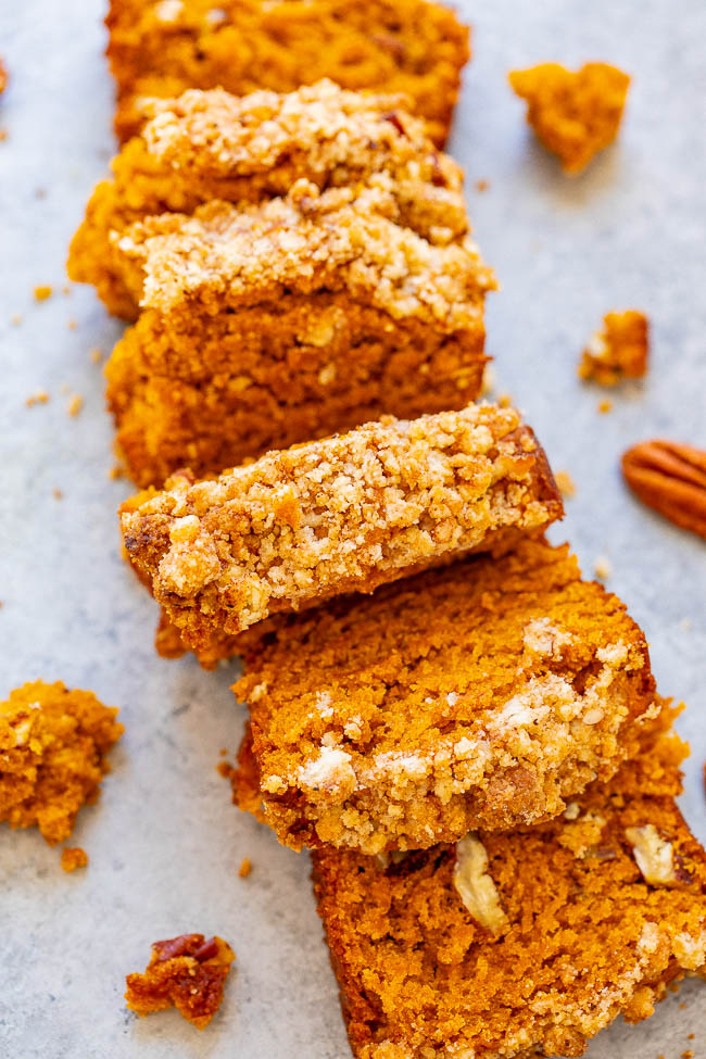 sliced mini loaf of pumpkin bread with crumble topping 