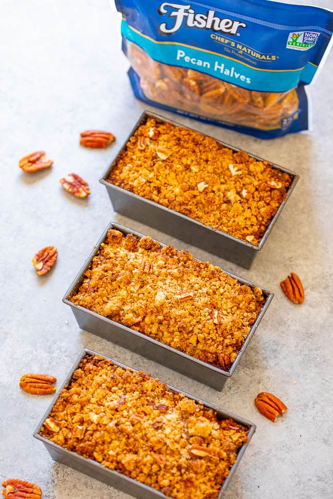 three mini pumpkin nut bread loaves next to a bag of Fisher pecans 