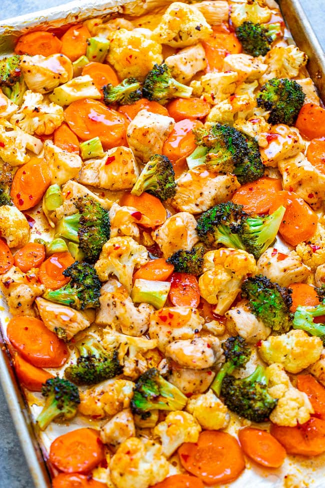 Sweet Chili Roasted Chicken and Vegetables - EASY, ready in 15 minutes, made on ONE sheet pan, and perfect for busy weeknights!! Accidentally healthy yet packed with the perfect flavor balance - a little bit sweet with a little bit of heat!!