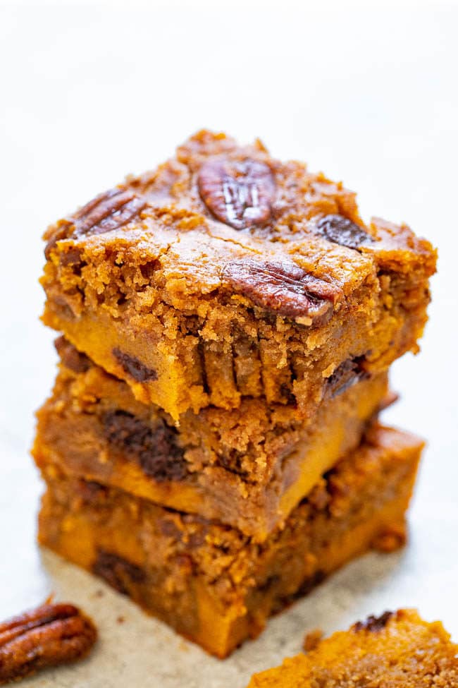 Soft Pumpkin Praline Bars - SUPER soft pumpkin bars studded with chocolate chips, candied pecans, and plenty of pumpkin pie spice!! A FAST and EASY dessert that feeds a crowd for your fall and winter celebrations!!