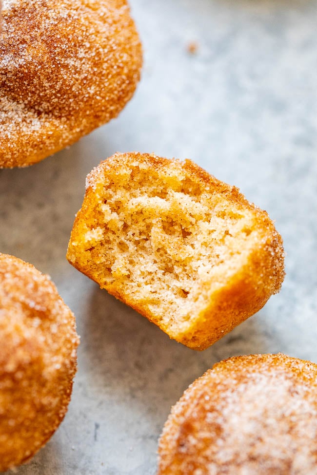 close up of a snickerdoodle muffin with a bite missing 