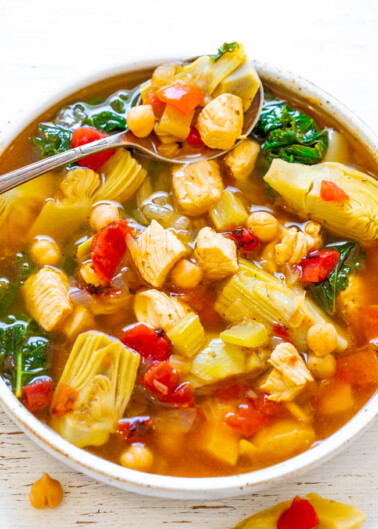 30-Minute Mediterranean Chicken Soup - An EASY soup that's both HEALTHY and HEARTY!! Loaded with tender chicken, vegetables, garbanzo beans, and more! Ready so fast and it's perfect for busy chilly winter weeknights!!