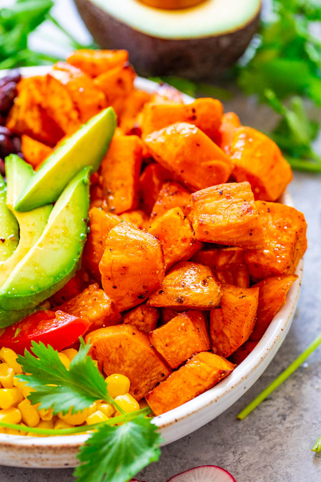 Mexican Sweet Potato Bowl — A HEALTHY and EASY alternative to a salad!! Loaded with Mexican-inspired ingredients and topped with a light lime-cumin vinaigrette! Ready in 20 minutes and perfect for MEAL PREPPING!!
