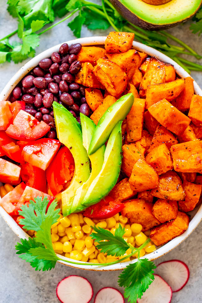 Mexican Sweet Potato and Black Bean Buddha Bowl - A HEALTHY and EASY alternative to a salad!! Loaded with Mexican-inspired ingredients and topped with a light lime-cumin vinaigrette! Ready in 20 minutes and perfect for MEAL PREPPING!!