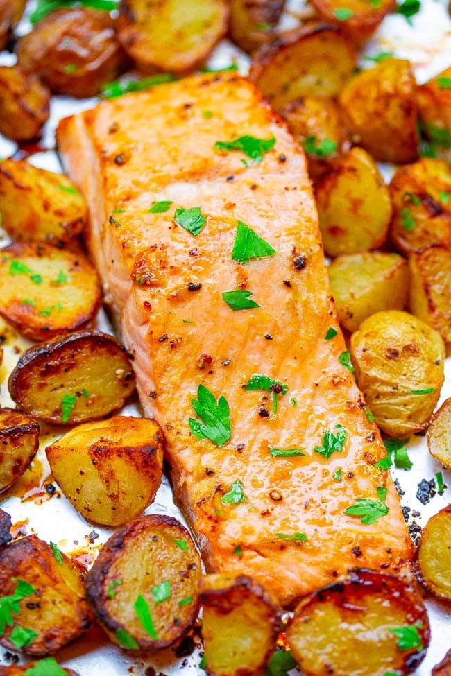 Sheet Pan Lemon Dijon Baked Salmon and Potatoes - This baked salmon and potatoes recipe is ready in 25 minutes, the lemon butter and Dijon mustard add so much FLAVOR, and it's made on ONE sheet pan!! EASY comfort food for busy weeknights!!