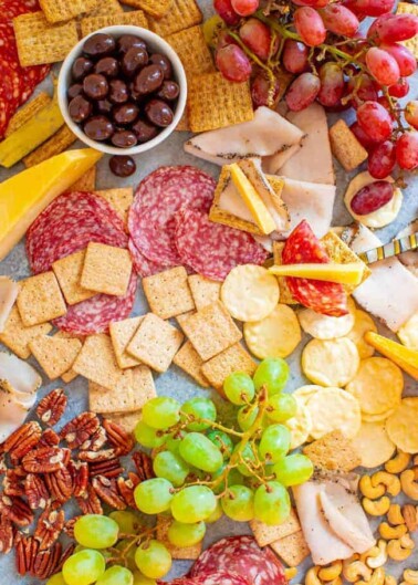 Girls Night Charcuterie Board - A SALTY-SWEET mix of meats, cheeses, fruit, chocolate almonds, Triscuits, Wheat Thins, Good Thins, and more for your next GIRLS-NIGHT-IN!! There's something for everyone on this EASY-TO-ASSEMBLE board!!