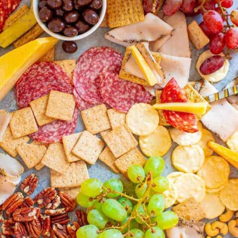 Girls Night Charcuterie Board - A SALTY-SWEET mix of meats, cheeses, fruit, chocolate almonds, Triscuits, Wheat Thins, Good Thins, and more for your next GIRLS-NIGHT-IN!! There's something for everyone on this EASY-TO-ASSEMBLE board!!