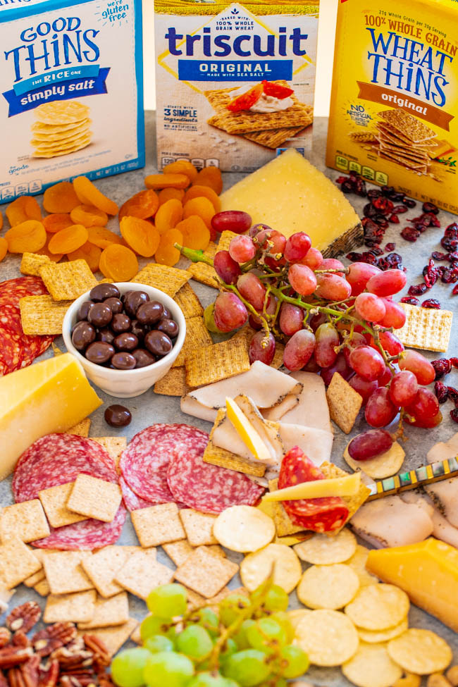 Girls Night Charcuterie Board - A SALTY-SWEET mix of meats, cheeses, fruit, chocolate almonds, Triscuits, Wheat Thins, GOOD THiNS, and more for your next GIRLS-NIGHT-IN!! There's something for everyone on this EASY-TO-ASSEMBLE board!!