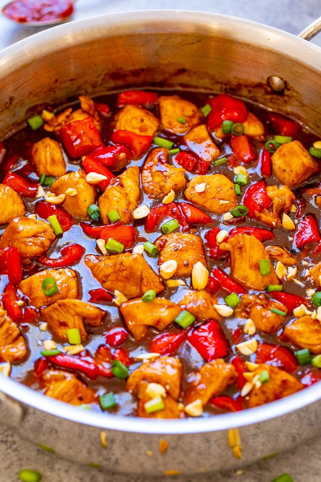 chinese kung pao chicken in a metal skillet 