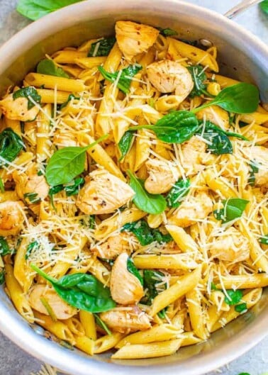 Parmesan Chicken and Spinach Pasta - EASY and ready in 20 minutes with comforting pasta, juicy chicken, a hint of lemon, and the PERFECT amount of Parmesan!! Great for busy weeknights and the extra is good for meal prepping!! 