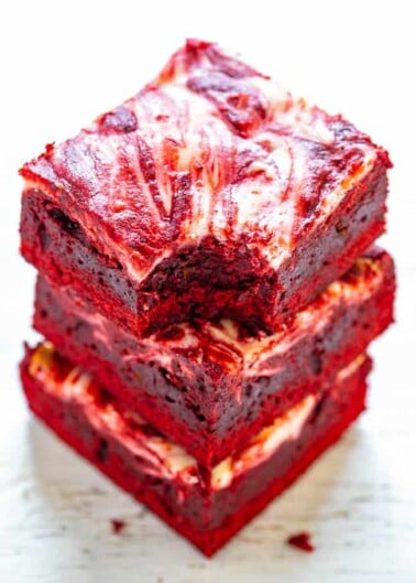 Red Velvet Cheesecake Brownies - Rich, decadent, red velvet brownies topped with tangy cream cheese swirls!! PERFECT for Valentine's Day, the Christmas season, or anytime you're craving red velvet! EASIER than you think to make!!