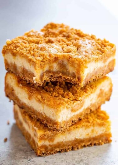 Butterscotch Graham Cracker Cheesecake Bars - A super chewy crust made with butterscotch chips and graham cracker crumbs that also doubles as the topping!! The silky smooth tangy cheesecake layer is the PERFECT contrast! A simple recipe that FAR EXCEEDED expectations!!