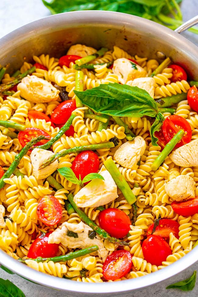 Chicken Asparagus Pasta — EASY, ready in 20 minutes, and the asparagus, tomatoes, and basil keep this chicken and pasta recipe tasting LIGHTER and FRESHER!! Perfect for picnics, potlucks, and busy weeknight dinners!!