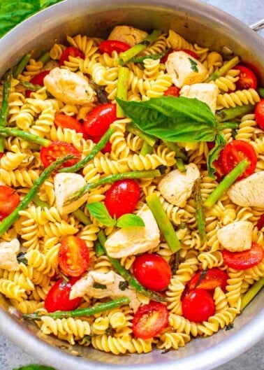 Chicken and Pasta with Asparagus and Tomatoes - EASY, ready in 20 minutes, and the asparagus, tomatoes, and basil keep this chicken and pasta recipe tasting LIGHTER and FRESHER!! Perfect for picnics, potlucks, and busy weeknight dinners!!