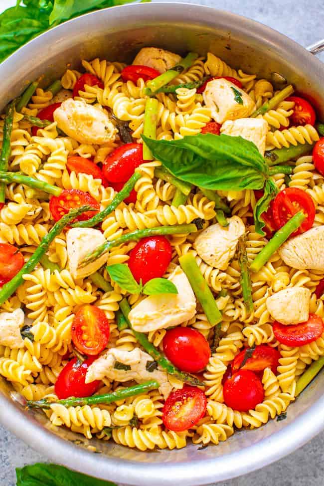 Chicken Asparagus Pasta — EASY, ready in 20 minutes, and the asparagus, tomatoes, and basil keep this chicken and pasta recipe tasting LIGHTER and FRESHER!! Perfect for picnics, potlucks, and busy weeknight dinners!!