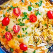 Salsa Verde Chicken Chilaquiles - An EASY comfort food recipe with just FOUR main ingredients and ready in 30 minutes!! Layers of corn tostadas and juicy chicken smothered in salsa verde and melted pepper Jack cheese! Great for breakfast, dinner, snacks, a party appetizer or anything in between!!