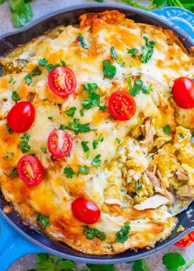 Salsa Verde Chicken Chilaquiles - An EASY comfort food recipe with just FOUR main ingredients and ready in 30 minutes!! Layers of corn tostadas and juicy chicken smothered in salsa verde and melted pepper Jack cheese! Great for breakfast, dinner, snacks, a party appetizer or anything in between!!