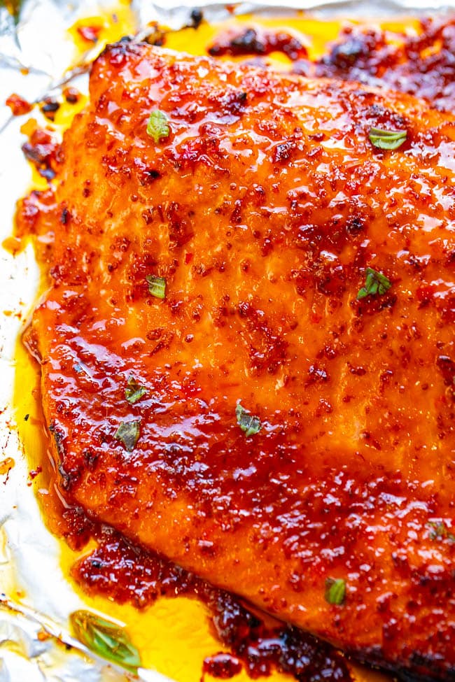 Sheet Pan Sweet Chili Salmon — A 5-ingredient salmon recipe that tastes like 5 STARS and is ready in 25 minutes!! Loaded with layers of incredible flavor from two types of chili sauce, Dijon mustard, and honey! You'll LOVE this salmon recipe!!