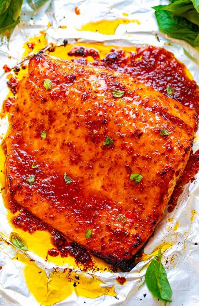 Sheet Pan Chili Dijon Salmon - A 5-ingredient salmon recipe that tastes 5-STARS and is ready in 25 minutes!! Loaded with layers of incredible flavor from two types of chili sauce, Dijon mustard, and honey! You'll LOVE this salmon recipe!!