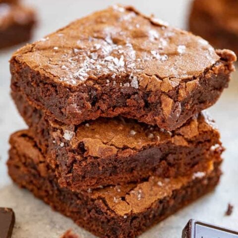 The Best Fudgy Sea Salt Brownies - Only 7 ingredients in these EASY, one-bowl, no-mixer brownies that are MY NEW FAVORITE BROWNIES!! Super fudgy, slightly chewy edges, crackly top, and ultra dark chocolate paired with sea salt for the HOLY GRAIL of brownies!!