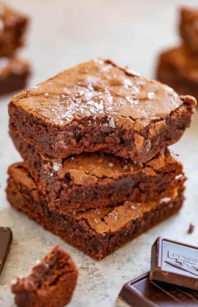 The Best Fudgy Sea Salt Brownies - Only 7 ingredients in these EASY, one-bowl, no-mixer brownies that are MY NEW FAVORITE BROWNIES!! Super fudgy, slightly chewy edges, crackly top, and ultra dark chocolate paired with sea salt for the HOLY GRAIL of brownies!!