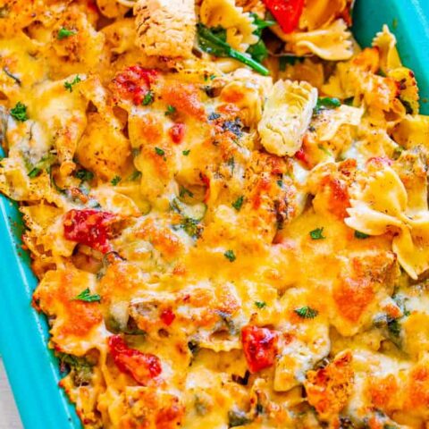 Cheesy Spinach and Artichoke Chicken Pasta - Imagine spinach and artichoke-flavored PASTA spiked with juicy chicken, red peppers, and TWO types of melted cheese!! A family favorite big-batch COMFORT FOOD PANTRY RECIPE that's great for meal prepping!!