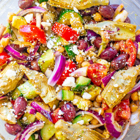 Loaded Greek Salad - An amped up version of a classic Greek salad with avocado, artichokes, garbanzo beans, and more!! The tangy Greek salad dressing is ready in seconds and is a major flavor booster! Naturally gluten-free and vegetarian!!
