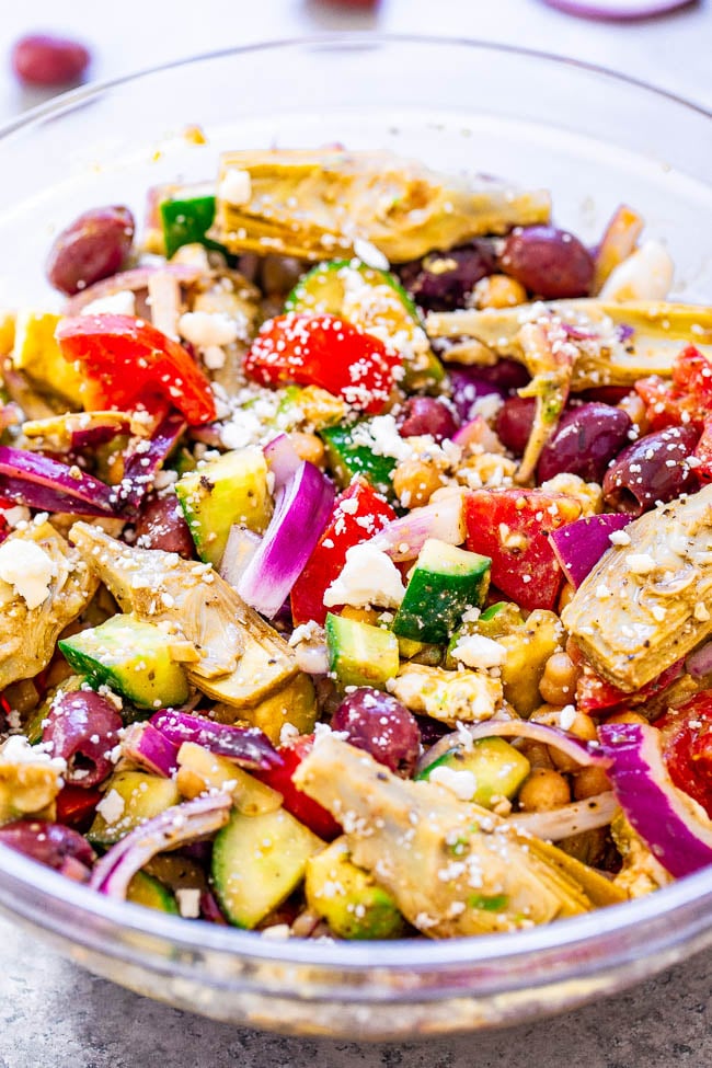 Loaded Greek Salad - An amped up version of a classic Greek salad with avocado, artichokes, garbanzo beans, and more!! The tangy Greek salad dressing is ready in seconds and is a major flavor booster! Naturally gluten-free and vegetarian!!