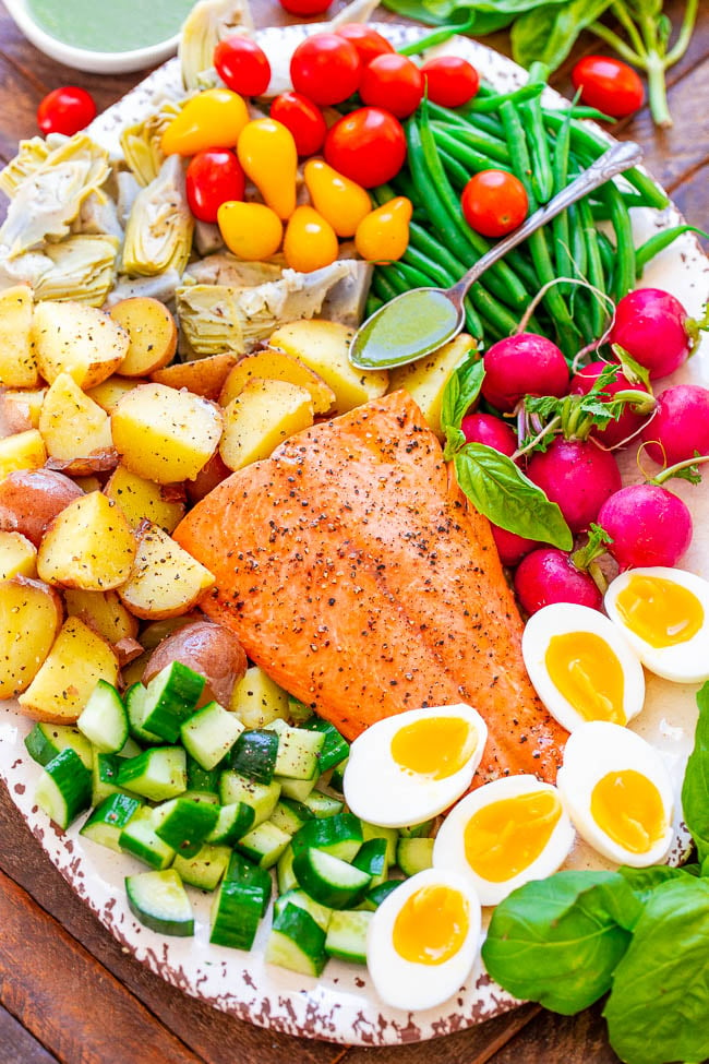 Salmon Niçoise Salad with Basil Vinaigrette - An ELEGANT French-inspired salad with juicy salmon, tender potatoes, soft-boiled eggs, crispy haricots verts, and more - all drizzled with a super FLAVORFUL fresh basil vinaigrette!! This BEAUTIFUL salad has something for everyone!!