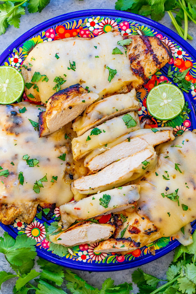 Grilled Salsa Verde Pepper Jack Chicken - The EASIEST salsa verde marinade keeps this chicken so juicy and tender!! Melted pepper Jack cheese on top takes an already awesome piece of chicken and makes it that much BETTER!!