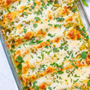Salsa Verde Chicken Enchiladas - EASY juicy enchiladas with so much flavor from the salsa verde and TONS of melted CHEESE!! Ready in 30 minutes, are made with just a handful of ingredients, and will be an instant family favorite!!