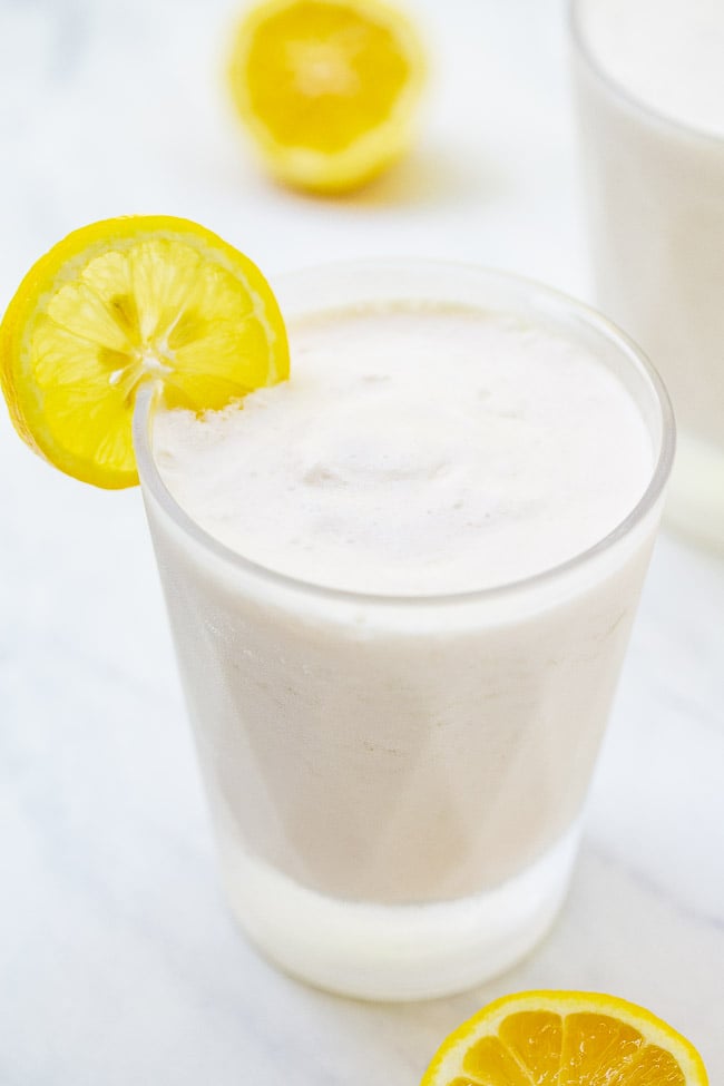 Frozen Coconut Lemonade - The EASIEST THREE ingredient whipped lemonade recipe that's creamy and refreshing with the PERFECT pop of tart lemon flavor!! You can easily spike it for an adults-only batch that's perfect for summer days!!
