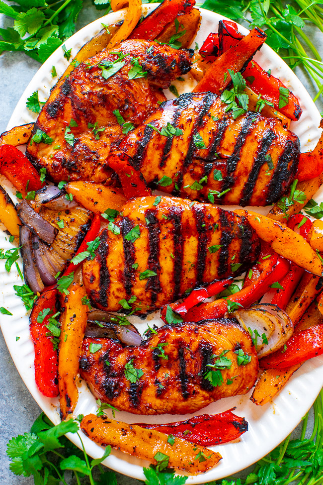 Grilled Sriracha Barbecue Chicken - EASY, ready in 10 minutes, and the chicken is just spicy enough with that perfect BBQ chicken flavor!! Grilled peppers on the side makes for the PERFECT summer meal that's HEALTHY and DELICIOUS!!