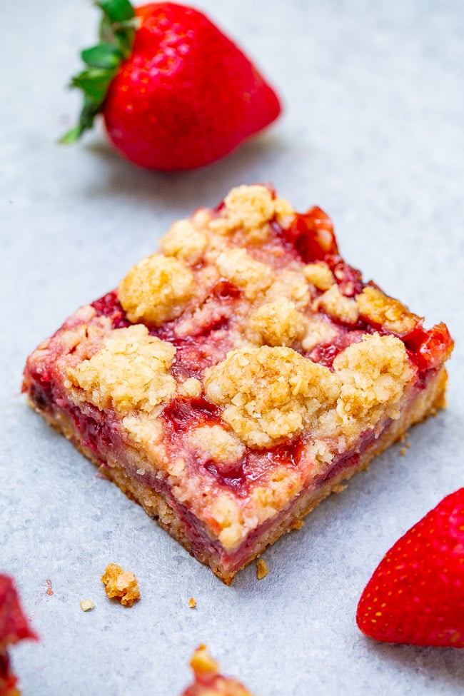 Strawberry Bars with Oatmeal Crumble Topping - These buttery bars are bursting with fresh strawberries!! Just 10 minutes of prep, so EASY because the crust and crumble are one and the same, and a crowd FAVORITE every time!!