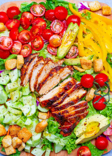 Chicken Chopped Salad - An EASY chopped salad with so much FLAVOR and CRUNCH topped with PERFECT juicy oven-baked chicken that's ready in 15 minutes!! Homemade honey apple cider vinaigrette adds the finishing touch!!