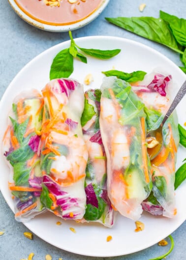 Fresh Spring Rolls with Peanut Sauce - Healthy rolls that taste just like your favorite Asian restaurant makes!! Fill them with your favorite veggies along with shrimp, chicken, or tofu - totally customizable! The homemade peanut sauce for dipping is AMAZING!!