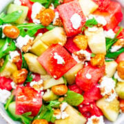 Balsamic Watermelon and Cucumber Salad - An EASY, healthy, and light salad with watermelon, cucumber, arugula, goat cheese, candied nuts, and drizzled with a homemade balsamic glaze!! A PERFECT summer salad for those days when it's too hot to cook!!