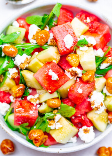 Balsamic Watermelon and Cucumber Salad - An EASY, healthy, and light salad with watermelon, cucumber, arugula, goat cheese, candied nuts, and drizzled with a homemade balsamic glaze!! A PERFECT summer salad for those days when it's too hot to cook!!