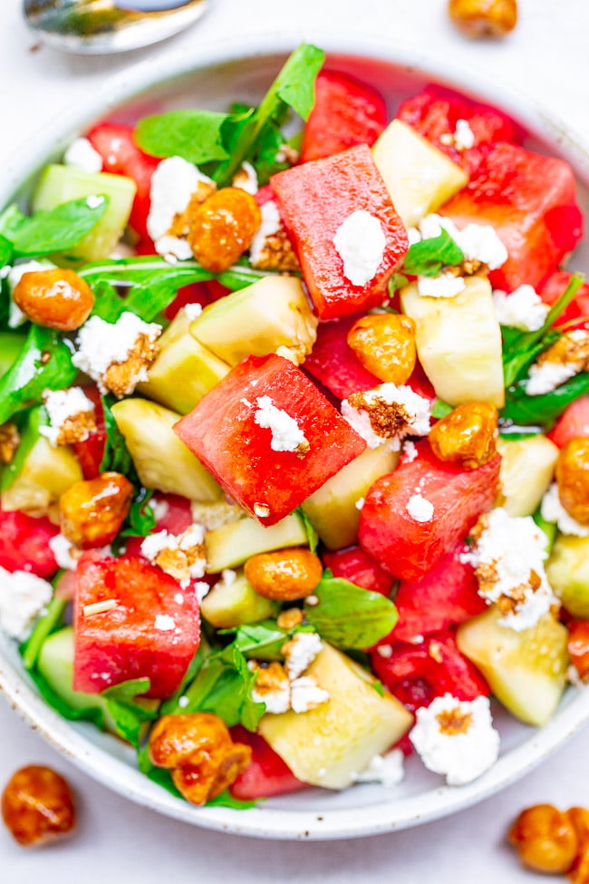 Balsamic Watermelon and Cucumber Salad - An EASY, healthy, and light salad with watermelon, cucumber, arugula, goat cheese, candied nuts, and drizzled with a homemade balsamic glaze!! A PERFECT summer salad for those days when it's too hot to cook!!