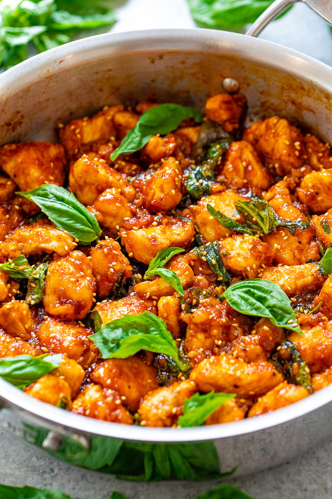 Sticky Basil Chicken - Skip takeout and make this AMAZING chicken that tastes like it's from an Asian restaurant at home in 15 minutes!! So EASY with the perfect balance of sweet, spicy, and plenty of fresh basil!!  