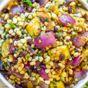 Grilled Corn and Black Bean Salad with red onion in a bowl.